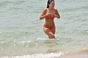 Two sexy ass girls on the beach in bikinis