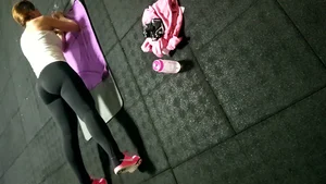 Girl With Fit Ass and Legs Working Out on Yoga Mat in Yoga Pants Creepshot