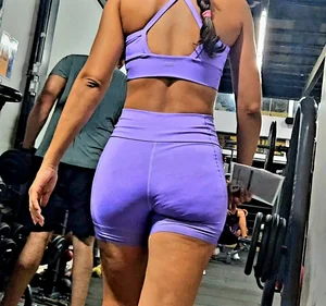 Girl in lilac short leggings at the gym