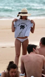 Cute beach girl with decent body in bikini