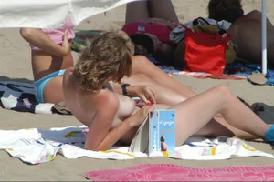 Girls on a nude beach in Sitges, Spain