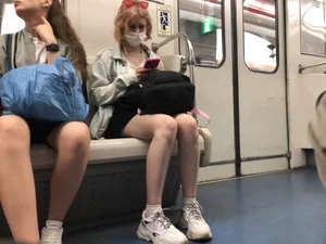 Masked Girl in Sneakers With Nice Legs Sitting in a Subway Train Creepshots