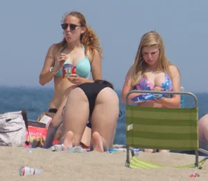 3 girls on the beach in bikinis with big boobs, one brunette and two blondes