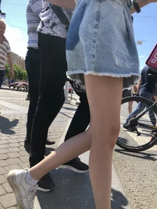 Teen Candid Girl in a Denim Skirt And Sneakers With Thin Legs on a Crosswalk Creepshots