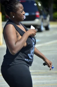 Chubby black lady with big tits and no bra lets it slip