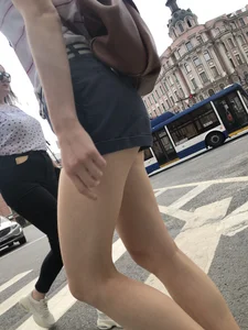 Young Girl in Shorts And Sandals Crossing the Street Gallery