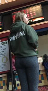 Hot blonde teen in movie theatre