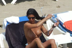Girls on a nude beach in Sitges, Spain