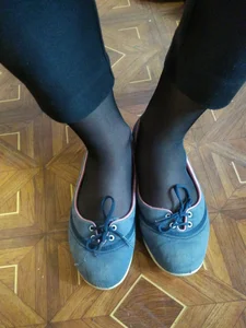 Feet in Flats and Black Pantyhose in College Classroom Closeup