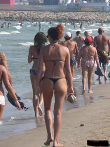 Bunch of sexy babes at the beach in thong bikinis