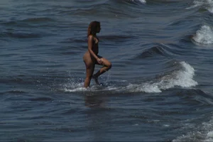 Girls on a nude beach in Sitges, Spain