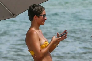Frankie Bridge nip slips in a bikini on the beach