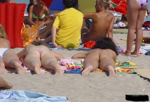 Beach voyeur girls in bikinis, thongs and topless