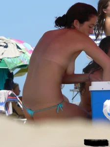 2 topless thonged sexy friends on the beach with great bodies