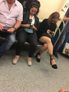 Girl in Glasses Sitting Cross-Legged in the Subway Train - Nice Legs Creepshot