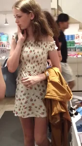 Incredibly cute girl in a summer dress store creepshot