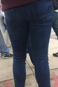 2 nice asses in tight jeans standing around