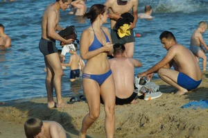 Girl with Wide Pelvis and Thin Waist in Blue Swimsuit Walking on Sand by the Water Beach Creepshots