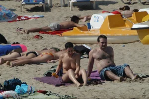 Girls on a nude beach in Sitges, Spain