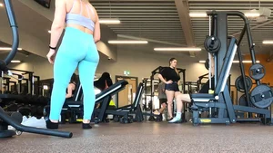 Gym blonde in turquoise leggings notices me and doesn’t mind, even moves in front of me later for some close-ups