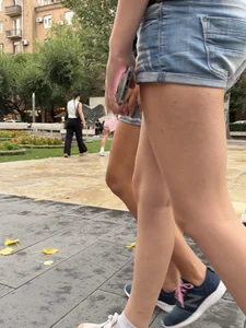Candid teen wearing denim shorts passing by, nice legs