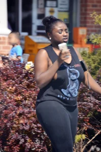 Chubby black lady with big tits and no bra lets it slip