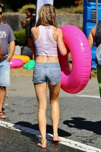 Tubing hottie in shorts and a wet white shirt