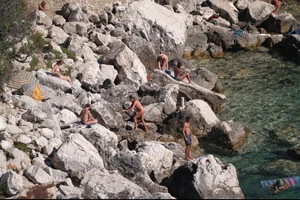Nude girls on a beach in Hvar, Croatia