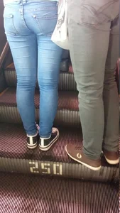Sticky Girl in Tight Jeans on a Subway Escalator Booty Closeup