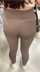 Cutie with round ass in beige leggings at the mall