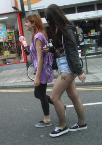 Candid cunny brunette in pantyhose and shorts showing her ass cheeks