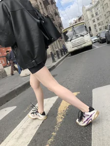 Very hot legs of a candid girl wearing a leather jacket