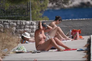 Nude girls on a beach in Hvar, Croatia