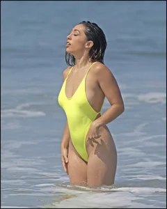 Sexy ass beach babe in a yellow thong swimsuit