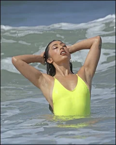 Sexy ass beach babe in a yellow thong swimsuit