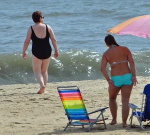 Thick beach girl in a teal bikini
