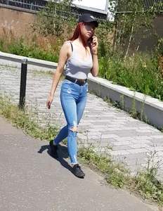 Redhead with a nice ass in tight jeans walking