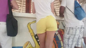 Milf in yellow shorts with vpl and a wedgie