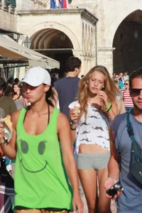 Sexy skinny blonde eating ice cream in short tight grey shorts