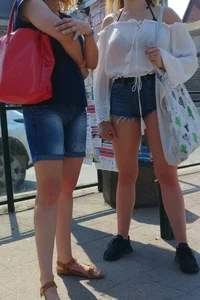 Sexy blonde showing her ass cheeks in short denim shorts and slightly see through shirt