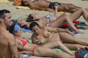 Topless girls on a beach in Barcelona