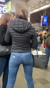 Nice big ass in tight blue jeans walking up stairs and standing in front of me