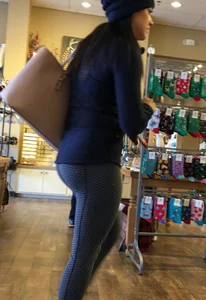 Brunette jewelry shopping in leggings with a nice ass
