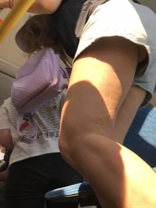 A Hot Candid Girl in Blue Denim Shorts Sitting in a Public Bus, Closeups of Her Legs And Upshorts Creepshot