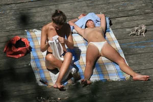 Two teens stripping and going topless to tan