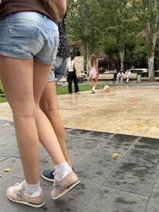 Candid teen wearing denim shorts passing by, nice legs