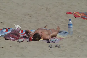 Girls on a nude beach in Sitges, Spain