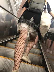 Cute Girl in Lacey Semi-Transparent Dress and Fishnet Pantyhose Subway Escalator Candid Photos Gallery