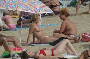 Topless girls on a beach in Barcelona