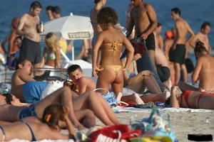 Beach voyeur girls in bikinis, thongs and topless